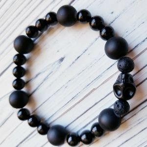 Black skull with lava rock